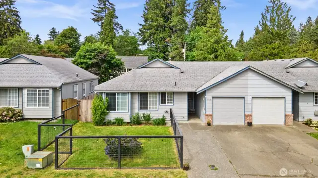 Unit is on Left with I car Garage and 3 Spaces with a widened driveway. Hog-Wire Fully Fenced Front Yard