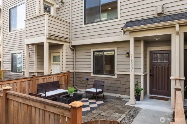 Fully fenced patio along private walkway
