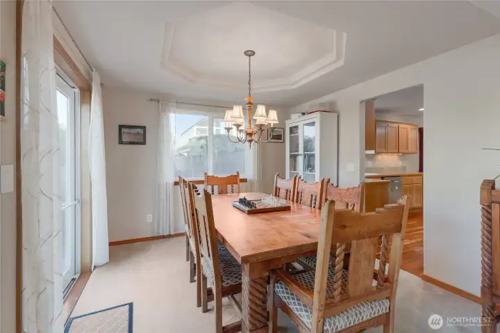 Step from the kitchen into the right-sized formal dining room.  The table pictured is quite large and it fits nicely in this space.