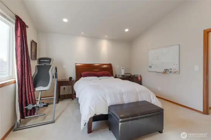 You will appreciate this home's 4 full bedrooms upstairs including this primary suite complete with vaulted ceilings.