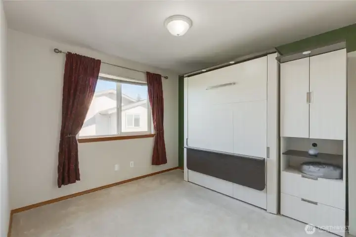One of the 3 secondary bedrooms in this home.  The Murphy Bed pictured is included in the sale!