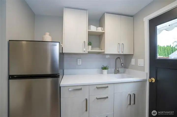 Versatile detached studio is perfect for guests, a home office, or business use .