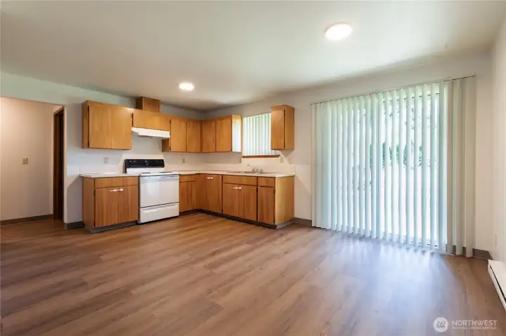Unit 705:  Kitchen Dining Area ~ Slider to Backyard Patio & Separated Fully Fenced Backyard