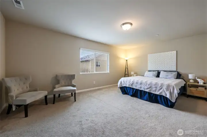 Stairway features an open hallway to this large primary suite!