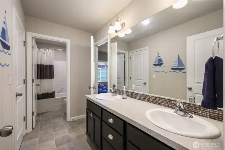 Jack-and-jill style bath means the convenince of two en suites, as well as access to the hallway for the ultimate in options!