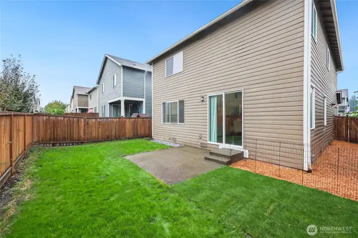 Fresh cedar chips on the side provide handy storage space with gate to front, or perfect dog run?