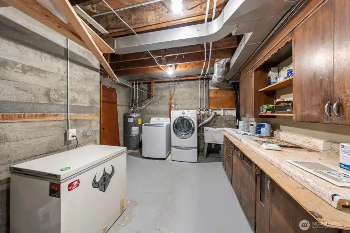 Unifished portion of the daylight lower. New plumbing, water heater.