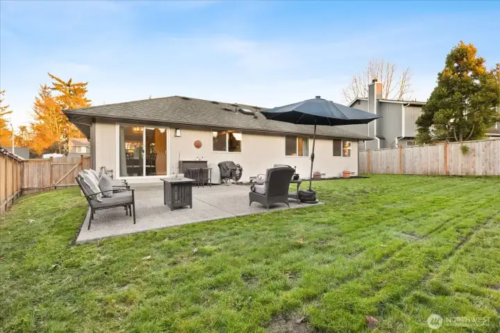 Large fenced private backyard & extended patio for entertaining