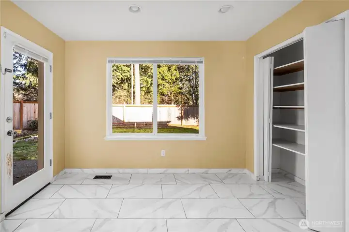 Dining area off kitchen with pantry area.