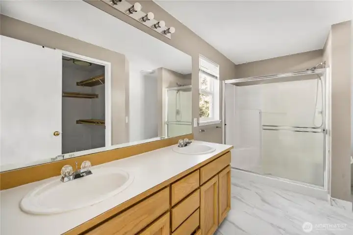 Primary en suite - private bathroom with dual sinks, shower and walk-in shower.