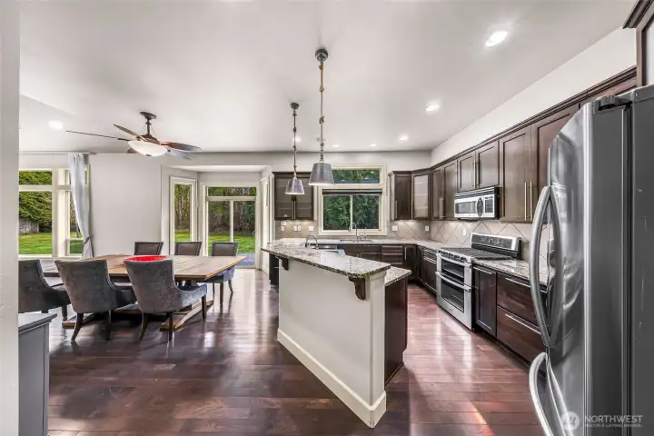 Kitchen looking toward dining area and backyard views