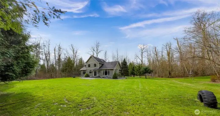 Expansive yard and lawn area surrounding the home