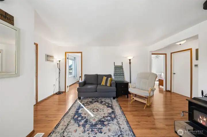 The family room is centrally located in the heart of the home between the two bedrooms & bathroom.