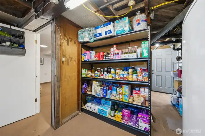 Storage options are not short in this home- part of the unfinished basement makes room for a great pantry area.