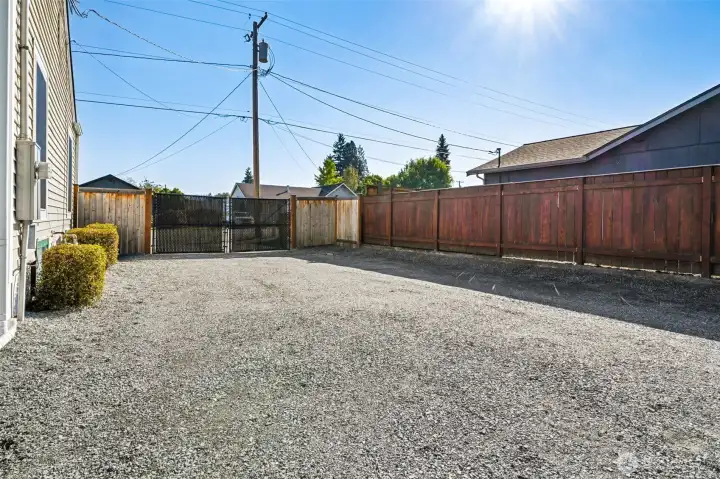 Large double gate on side of home to access backyard, parking, shop & room to bring in trailer!