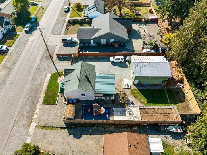 From above, you can see the full scope of this property’s features—plenty of parking in front, extra street parking, and easy access through the double gate to the spacious detached shop.