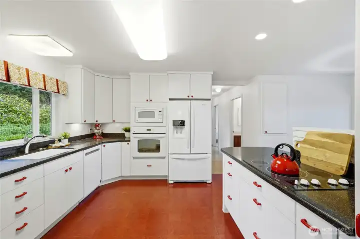 Spacious kitchen with plenty of cabinets and drawers.