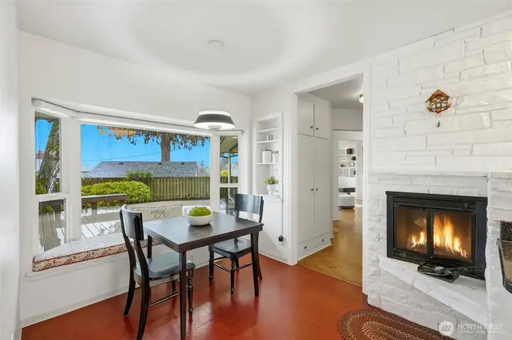 Informal nook and fireplace extend the kitchen.