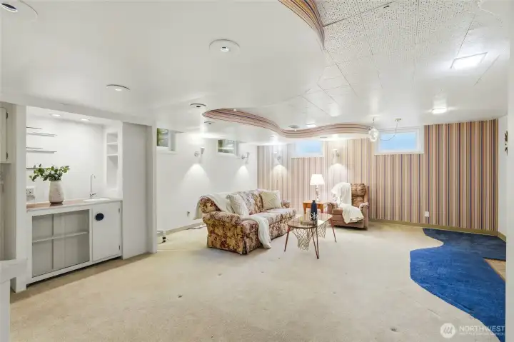 Large rec room upon landing in the lower level.