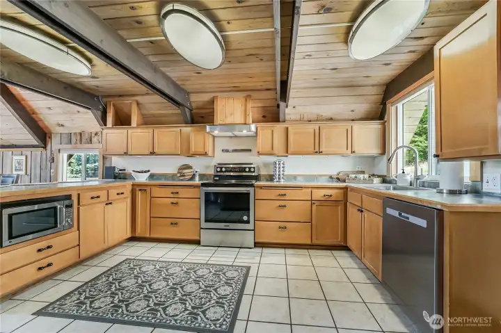 Nice size kitchen with stainless appliances & lots of beautiful wood cabinets!