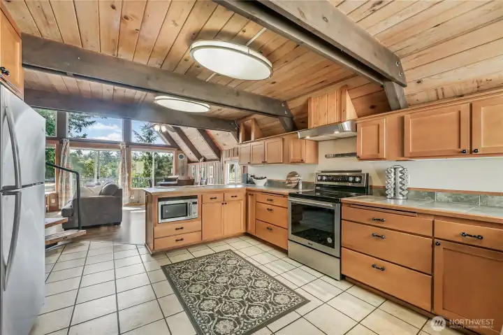 Spacious kitchen offers a new stove & deep stainless sink!