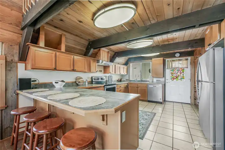 Spacious kitchen has additional seating for guests!