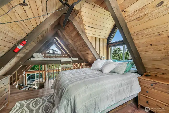 Adorable primary Loft bedroom and extra sleeping area for additional guests.