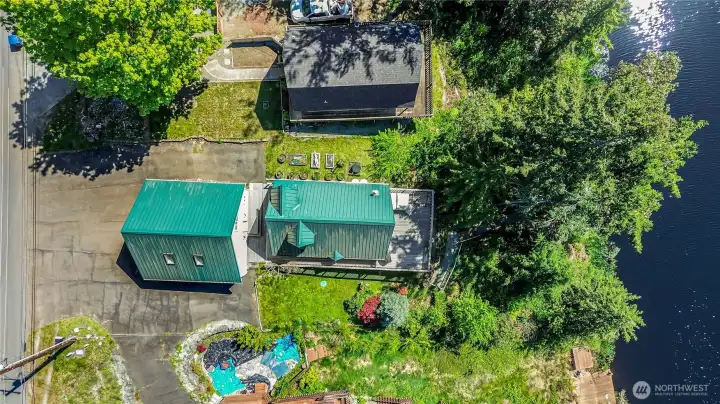 Aerial view of this great Island retreat on the lake!  House features a metal roof!