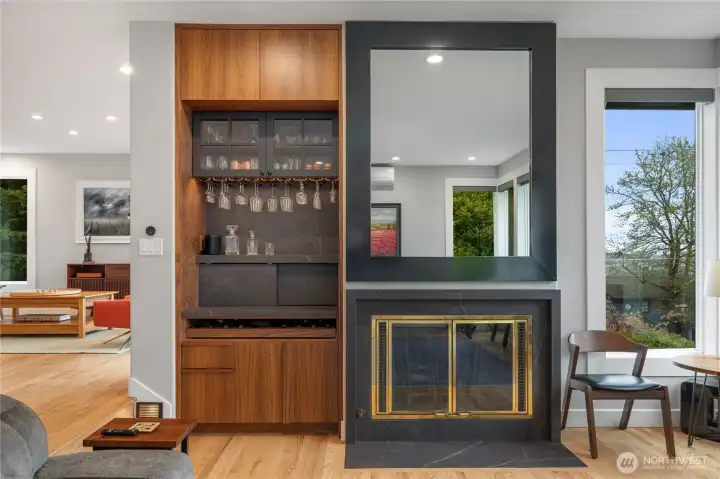 The beatifully crafted bar adds just the right touch to the room. Set away from the kitchen, it allows for easy flow and access.