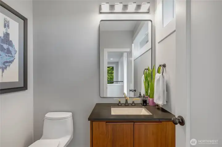 Tucked toward the top of the stairs, the half bath is convenient and allows for privacy.