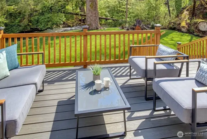 Backyard features large deck.