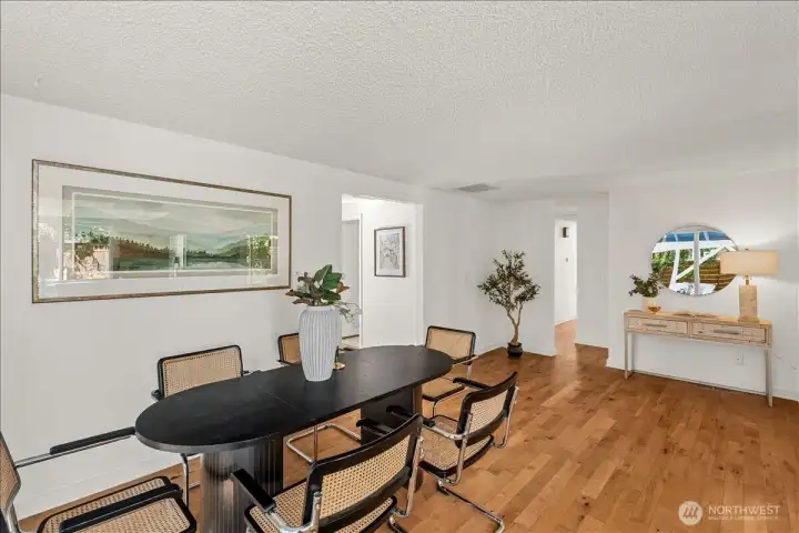 Dining Area – Spacious dining area with hardwood flooring and open sightlines to the main living spaces. Conveniently located adjacent to the kitchen for everyday dining and entertaining.