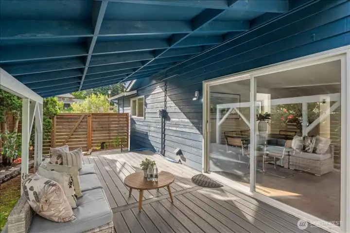 Covered Deck – Spacious covered deck with composite-style flooring and room for outdoor seating. Sliding glass door provides easy access to the interior living spaces.
