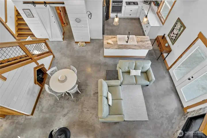a hallmark of classic barndominium living, the expansive open loft offers a seamless blend of rustic charm and modern versatility. Soaring above the main living space, the expansive loft embodies the essence of classic barndominium design.