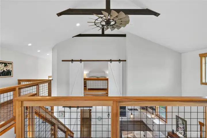 Framed by soaring ceilings and overlooking the living area below, this inviting space is ready t o become a cozy lounge, inspiring workspace, bunk room, or a media retreat - limited only by your imagination.