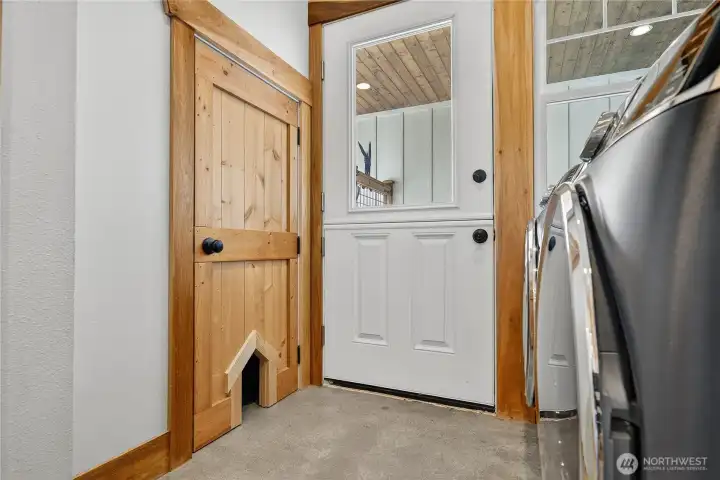 Enjoy a deep closet off Utility room for storage and easy pet access! A split barn door, or Dutch door, blends timeless charm with practical design, opening at the top for fresh air while keeping the lower half securely closed.