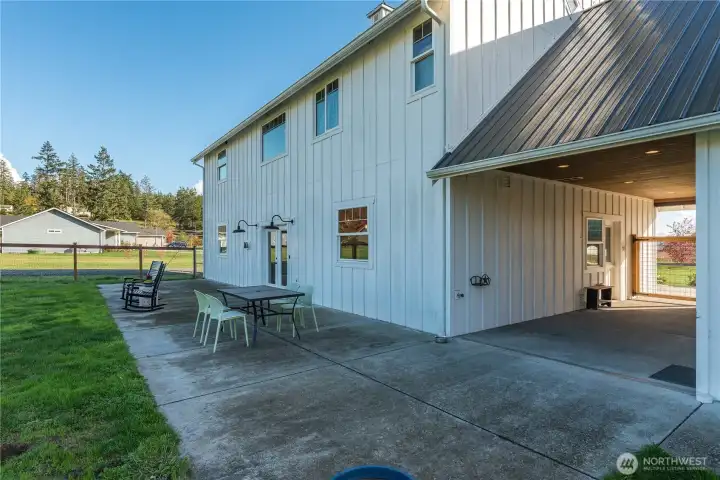 The possibilities are endless to transform the back patio into a seamless extension of the home by creating a custom covered outdoor living space with a fully equipped kitchen, perfect for entertaining or relaxing year-round.