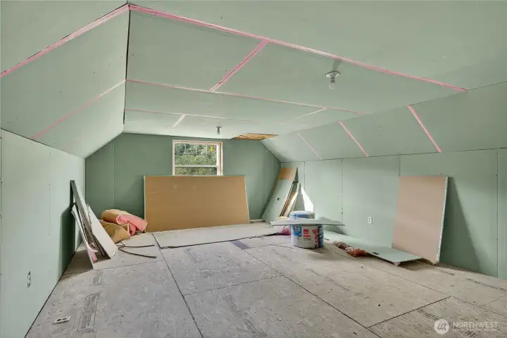 Unfinished room above the garage. The sellers intended to create a home office, then got called back to the actual office! Your dream, your potential for this space. Wired, insulated. Remaining materials convey.
