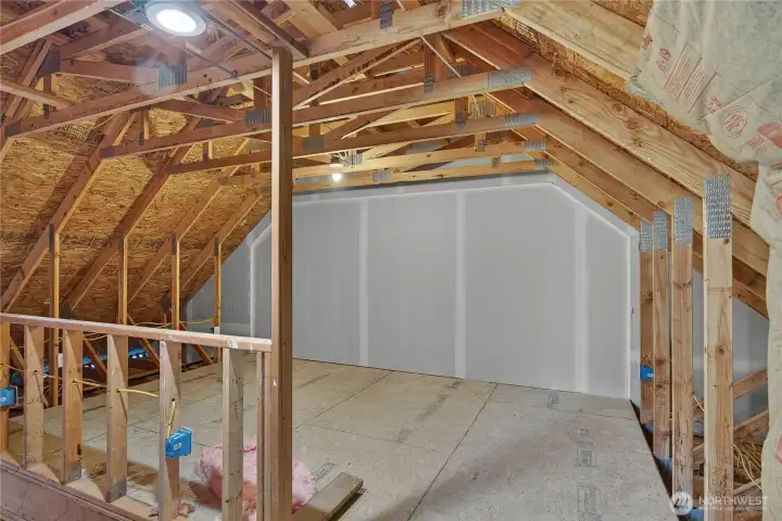 The other side of the upstairs garage unfinished and ready for your own creative design.