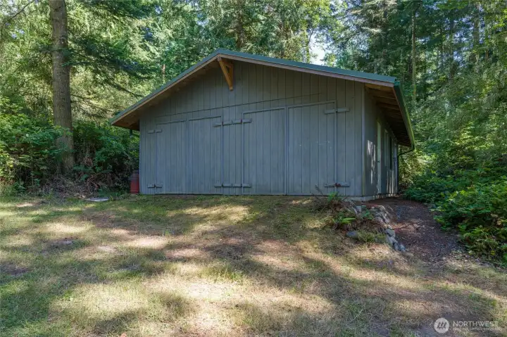West side of the garage with double doors. West side of the garage with double doors.