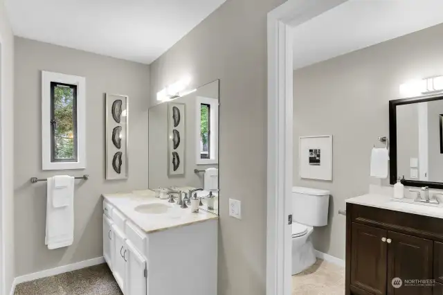 Primary oversized 3/4 tathroom shower plus separate vanity sink and cabinet