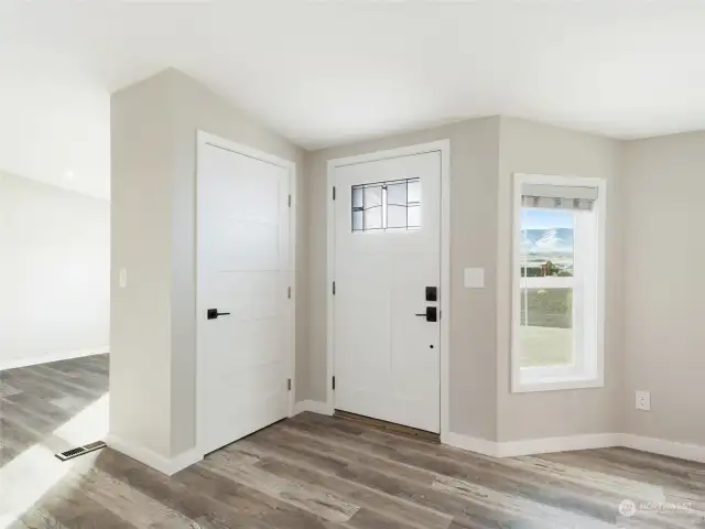 Front entry with closet.