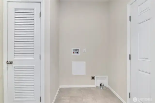 Laundry room with door to back yard.