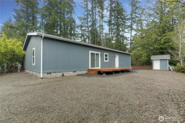 Oversized back yard awaits your garden.