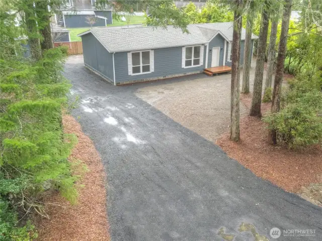 Drone shot showcases all the mature trees that provide a natural landscape of privacy.