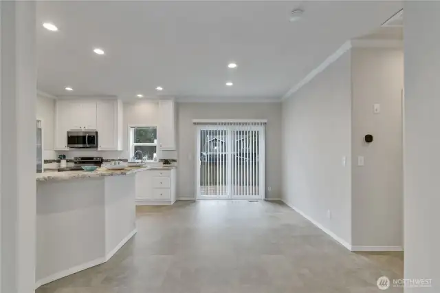 Dining area off of kitchen with slider door access to the back deck.