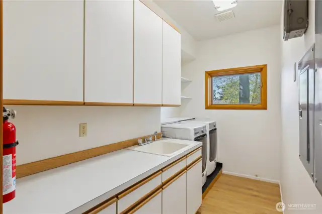 Great utility room with lots of cupobards first right down the hall.