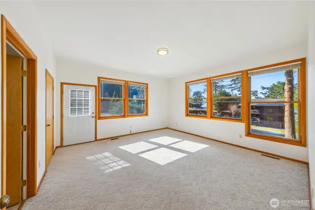 Primary bedroom has en-suite bath and door outside to private deck & back yard.