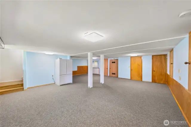 Spacious lower level has fridge, coffee bar, entry to outside under deck.