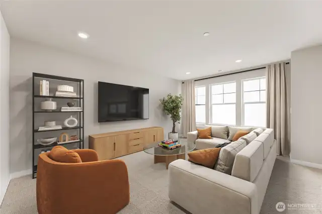 Large bonus room perfect for game, media, or playroom. Features French double doors and large windows for natural light. Photo contains virtual staging.